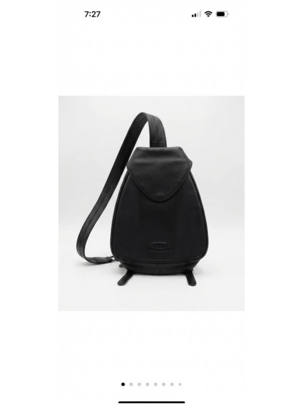 Alfred Sung black convertible sling backpack with flap top and zip pocket